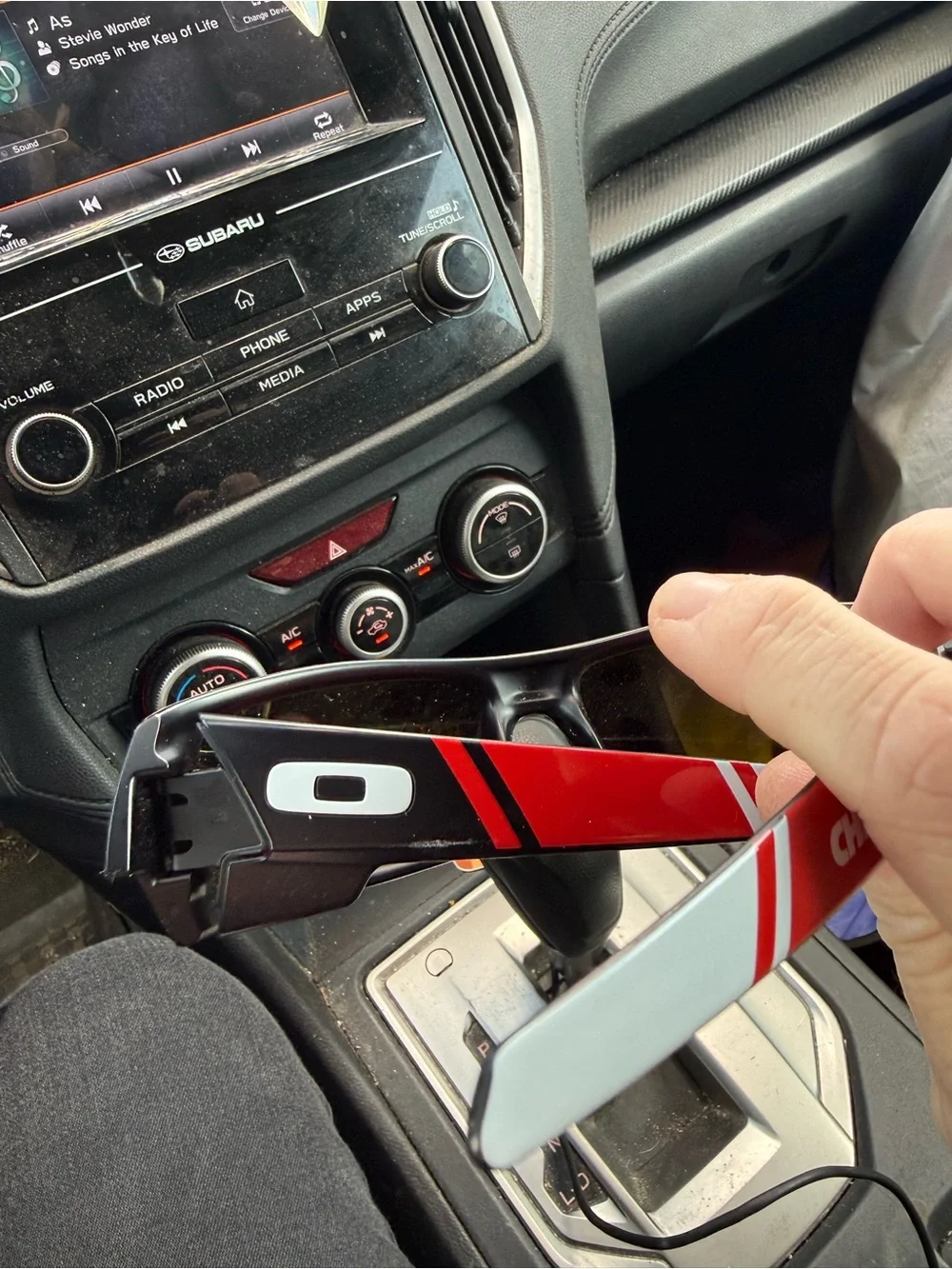 Oakley Black Frame Sunglasses with Red-Orange Mirrored Lenses